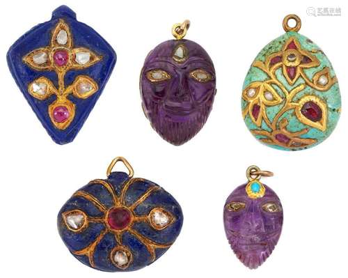 Five Indian gem-set pendants: two composed of carved amethys...