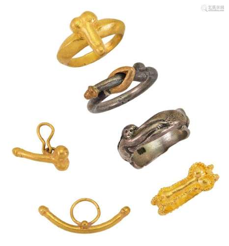 A group of erotic jewellery, comprising: four erotic rings, ...