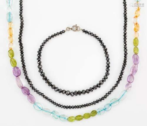 A black diamond necklace and bracelet and multi-gem bead nec...