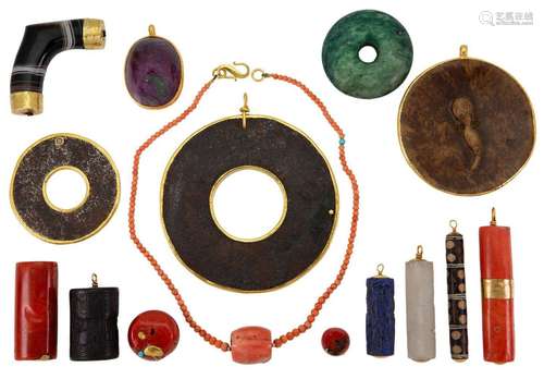 A group of pendants and other items, comprising: a gold moun...