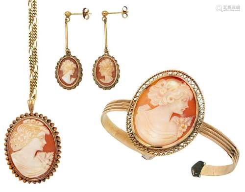 A suite of shell cameo jewellery comprising: a bangle, Briti...