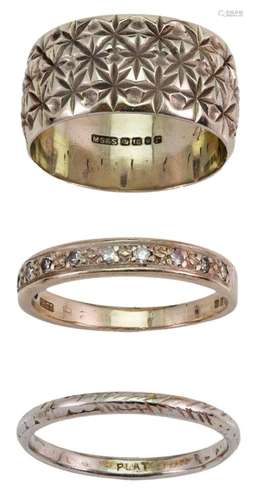 Three rings: comprising an 18-carat gold band ring with flow...