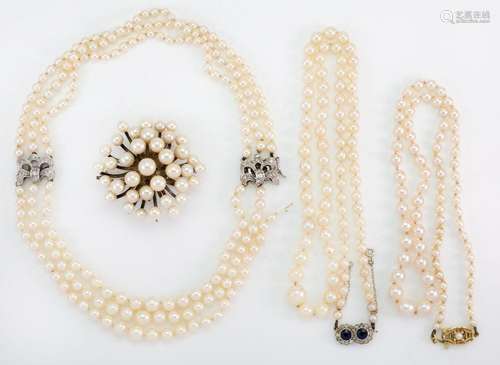 Three cultured pearl necklaces and a brooch, necklaces compr...