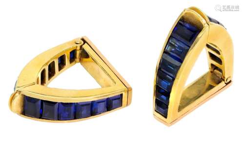A pair of sapphire cufflinks, by Sanz, each of hinged stirru...
