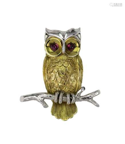 A gold and ruby brooch, designed as an Owl, with textured fe...