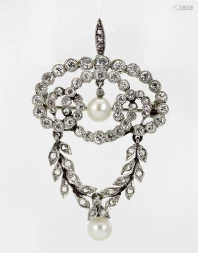 A diamond and pearl brooch/pendant, of open work scroll desi...