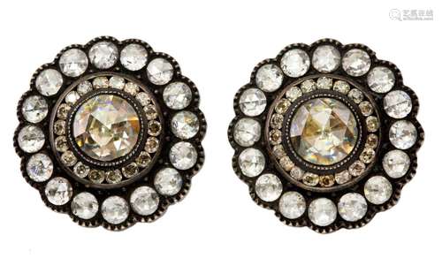 A pair of diamond earrings, each of cluster design set with ...