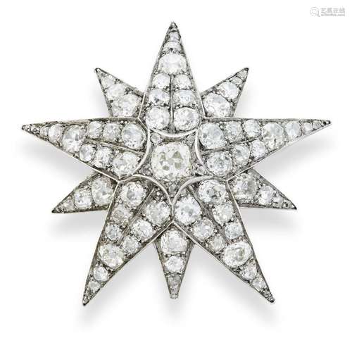 A diamond brooch, designed as a ten pointed star set with gr...