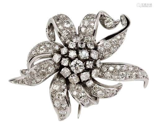 A diamond flowerhead spray cluster clip brooch, the stylised...