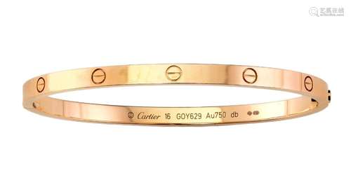 An 18ct gold 'Love Bangle' by Cartier, the hinged ...