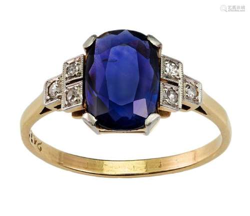 A Sapphire and diamond ring, claw set with an oval sapphire ...