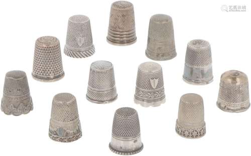 (12) piece lot of silver thimbles.