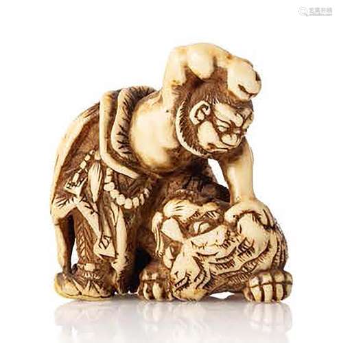 Japon, vers 1900 Netsuke représentant un guerrier maitrisant...