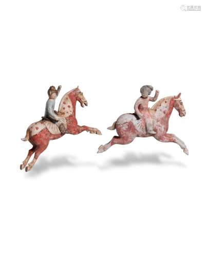 Two pottery figures of female polo players