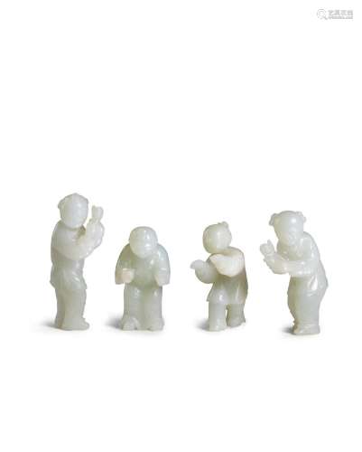 Four pale green jade figures of playing children