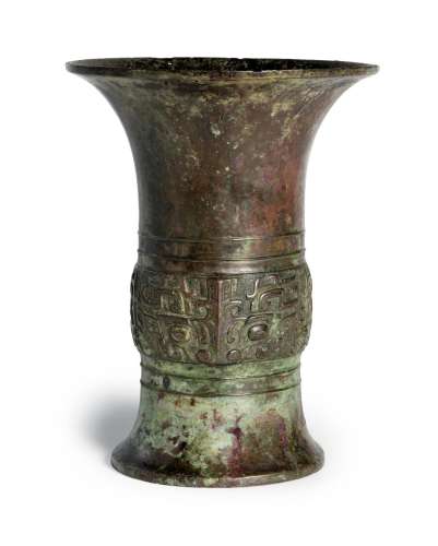 An archaic bronze taotie-mask wine vessel, zun