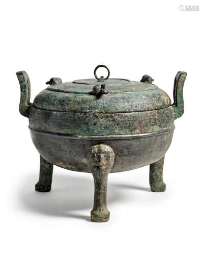 An archaic bronze ritual food vessel and cover, ding