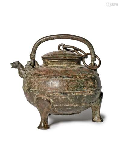 An archaic bronze water ewer and cover, he