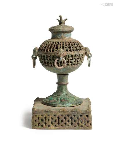 An archaic bronze openwork incense burner and cover