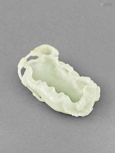 A pale green jade 'lotus and frog' washer