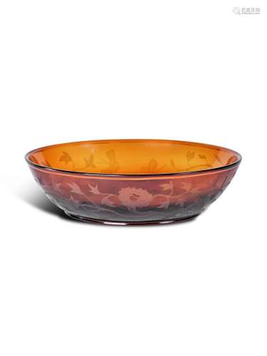 A translucent amber glass engraved 'floral' bowl