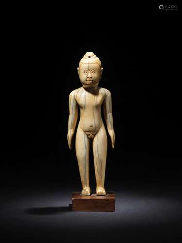 AN IVORY FIGURE OF A BOY