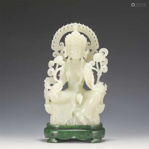 A Carved White Jade Seated Guanyin