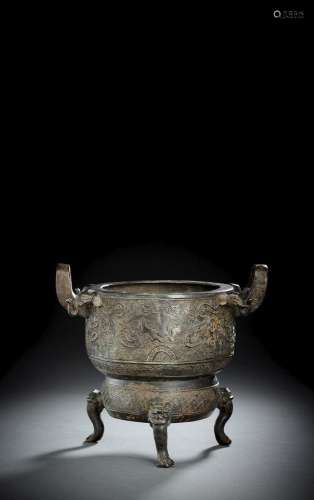A BRONZE TRIPOD CENSER IN ARCHAIC STYLE WITH TAOTIE AND ELEP...