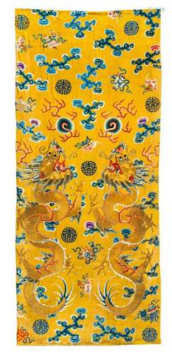 AN IMPERIAL YELLOW-GROUND SILK EMBROIDERED CURTAIN WITH A PA...