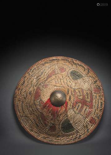 A RARE ARMY SHIELD MADE OF WOVEN RATTAN WITH POLYCHROME PAIN...