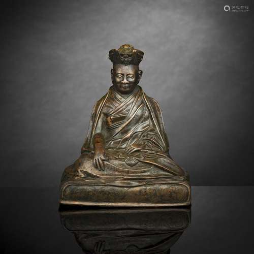 A BRONZE FIGURE OF A KARMAPA LAMA