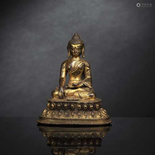 A GILT-BRONZE FIGURE OF SEATED BUDDHA