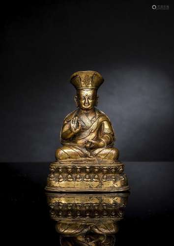 A FINE GILT-BRONZE FIGURE OF A GREAT LAMA