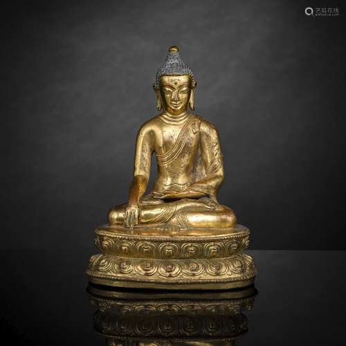 A GILT-BRONZE FIGURE OF BUDDHA SHAKYAMUNI