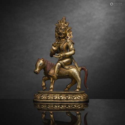 A GILT-BRONZE FIGURE OF A TANTRIC DIVINITY