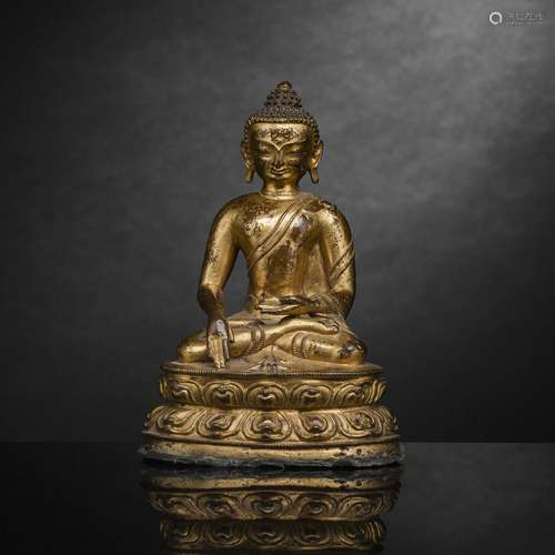 A GILT-BRONZE FIGURE OF BUDDHA SHAKYAMUNI