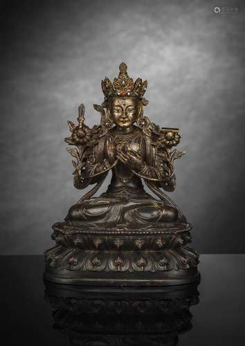 A FINE CAST BRONZE FIGURE OF SEATED MANJUSHRI WITH REMNANTS ...