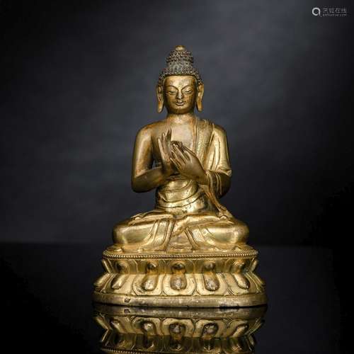 A GILT-BRONZE FIGURE OF BUDDHA SHAKYAMUNI