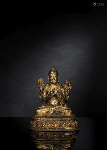 A GILT-BRONZE FIGURE OF A SASKYAPA LAMA