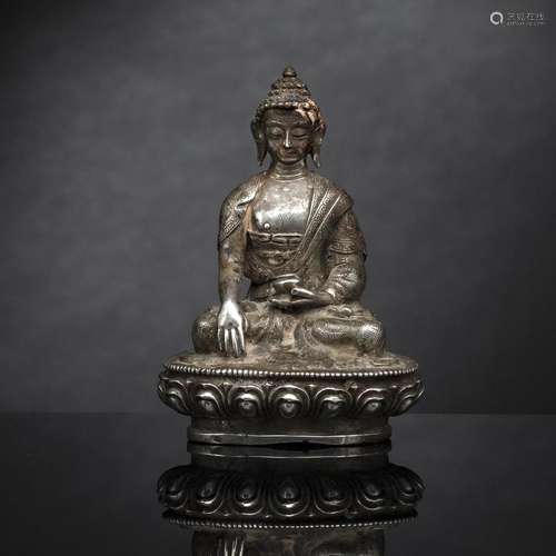 A SILVER FIGURE OF BUDDHA SHAKYAMUNI