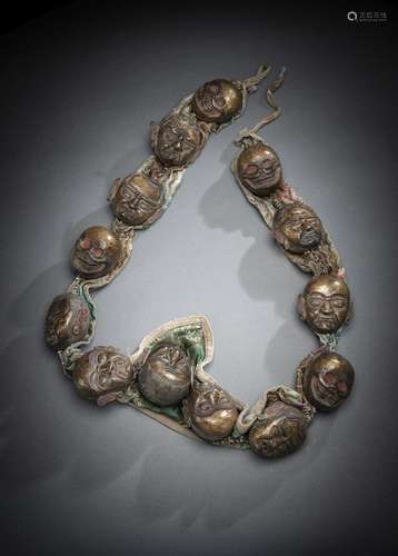 A BRONZE AND COTTON GARLAND, MALA