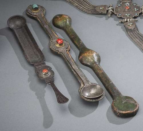 A SILVER SPOON WITH CORAL INLAY IN A WOODEN CASE AND AN IRON...