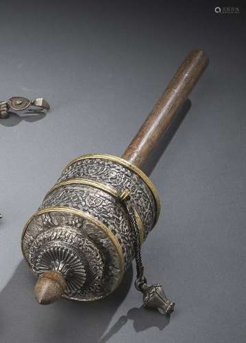 A FINE PART-GILT SILVER PRAYER WHEEL WITH WOOD HANDLE AND BA...