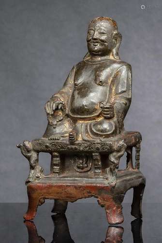 A BRONZE FIGURE OF BUDAI SEATED N A THRONE