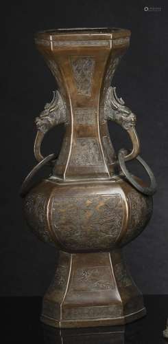 A HEXAGONAL BRONZE VASE IN ARCHAIC STYLE WITH HANDLES AND RI...