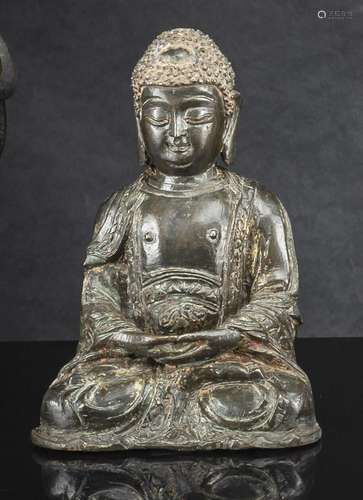 A BRONZE FIGURE OF SEATED BUDDHA WITH REMNANTS OF GILDING