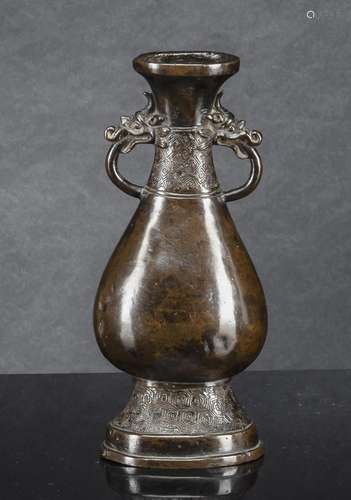 A BRONZE VASE WITH TWO HANDLES IN ARCHAIC STYLE