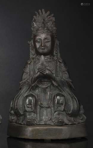 A BRONZE FIGURE OF BIXIA YUANJUN SEATED ON A WOODEN STAND