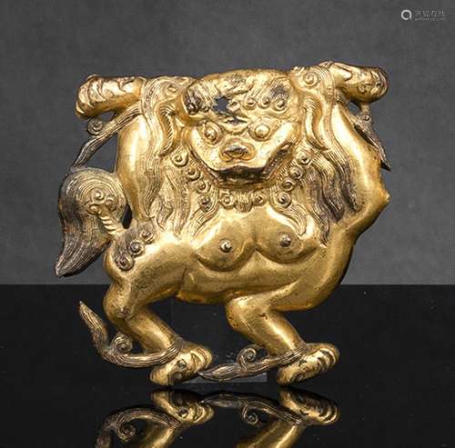 A GILT-COPPER PANEL OF A SNOW LION