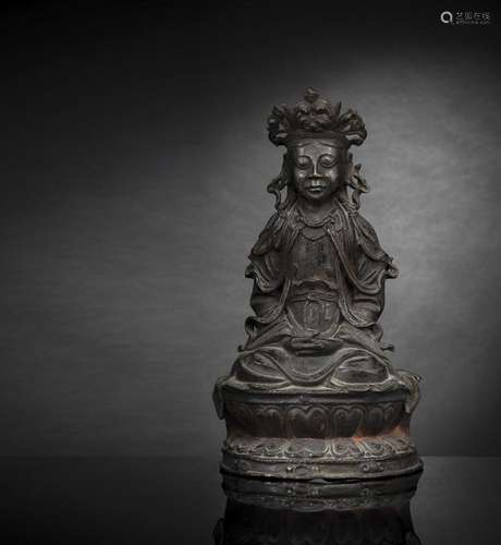 A BRONZE FIGURE OF GUANYIN